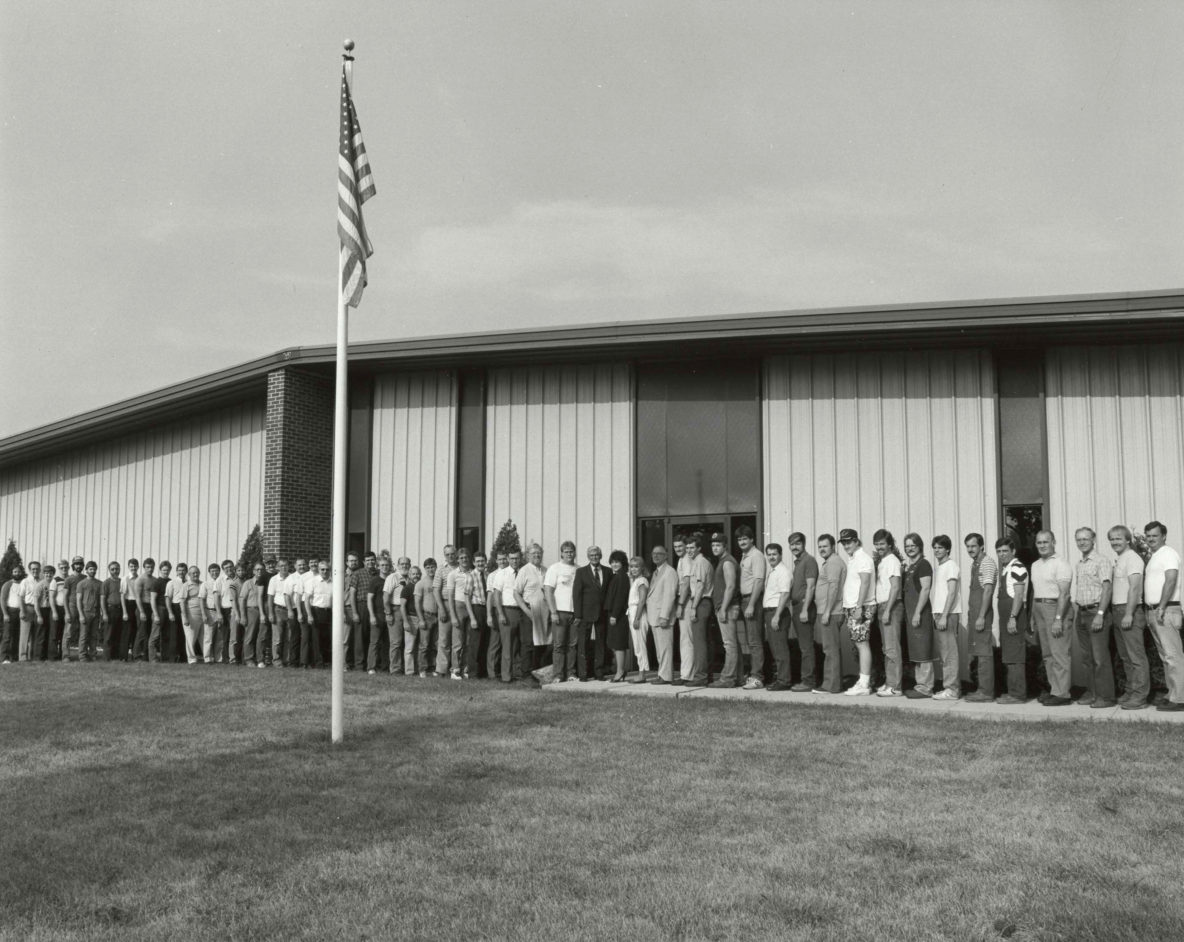 black and white photo of the ahaus team in front of building