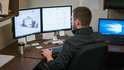 engineer typing on computer