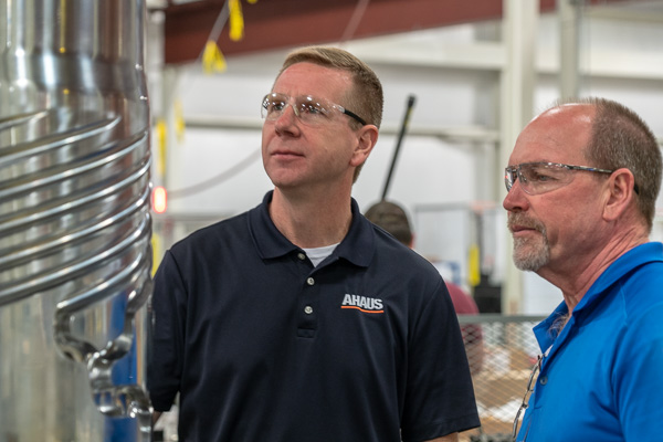 two engineers analyzing machine