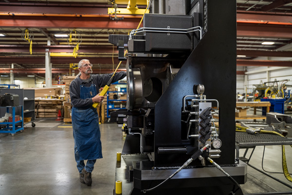 Ahaus employee testing a massive workholding fixture.