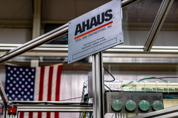 An Ahaus nameplate on the outside of an automation cabinet.