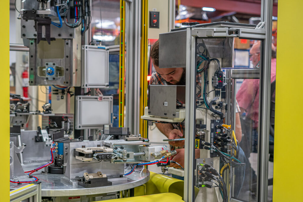 Engineer working on a custom automation assembly.